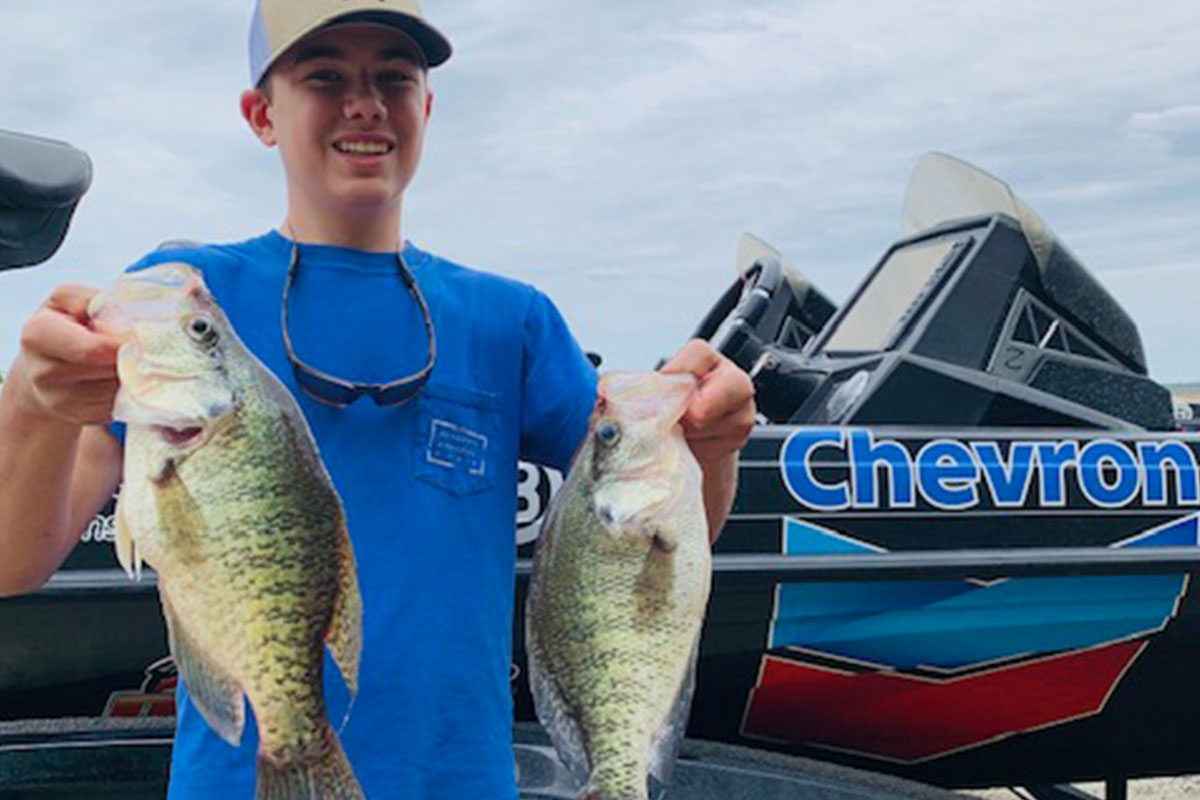 kid with crappie on guided fishing trip